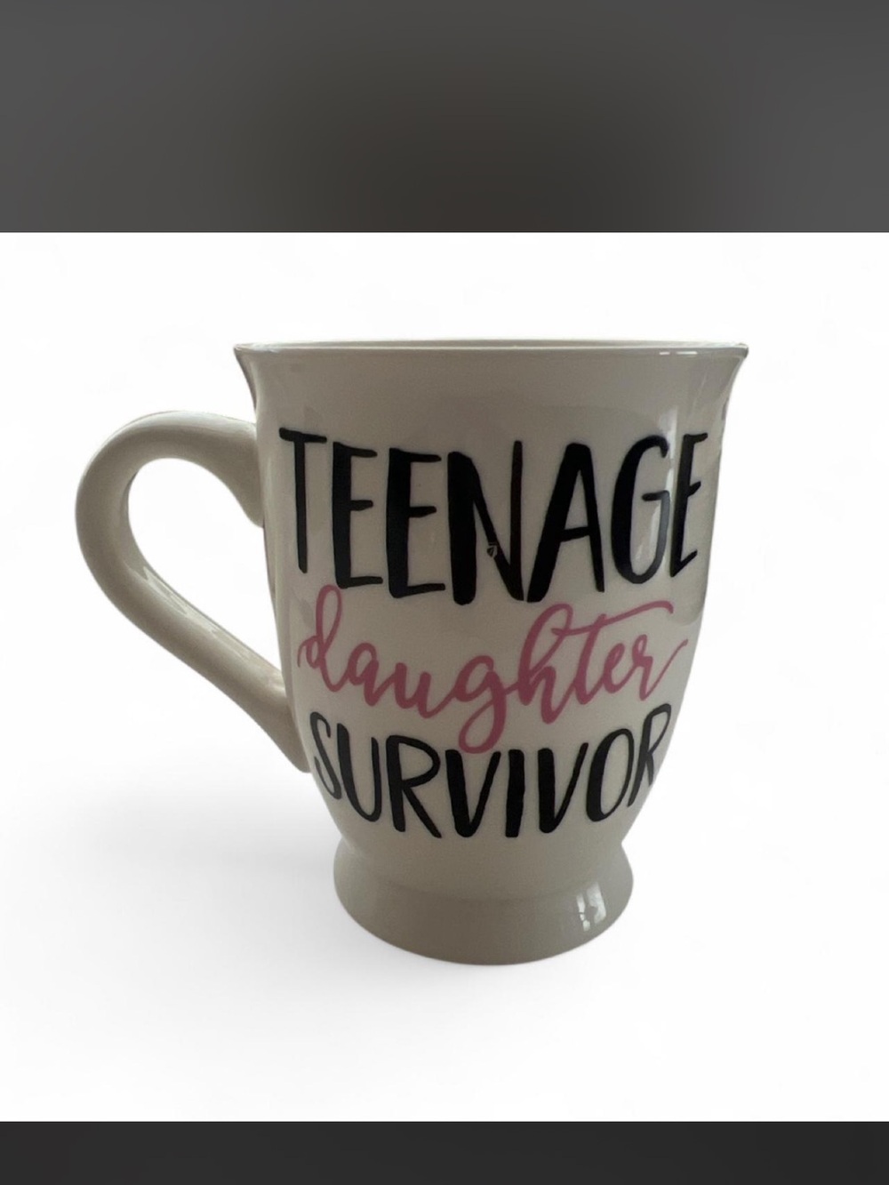 White Coffee Tea Mug with Black and Pink Lettering - "Teenage Daughter Survivor"